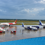 Rain-Soaked Airport Apron with Air India and IndiGo Jets