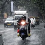 vehicles-ply-on-road-as-heavy-rainfall-lashes-in-1605572