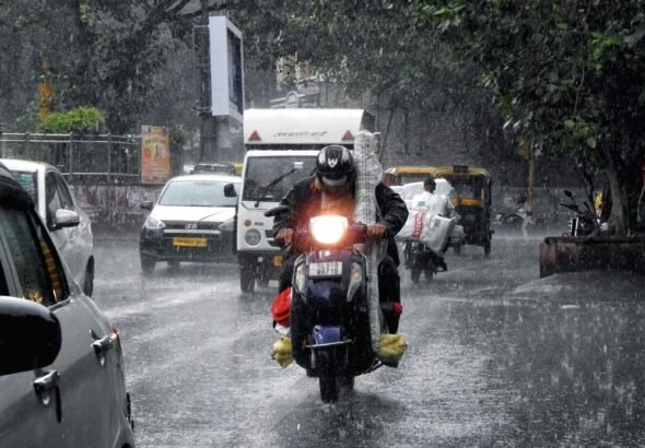 vehicles-ply-on-road-as-heavy-rainfall-lashes-in-1605572